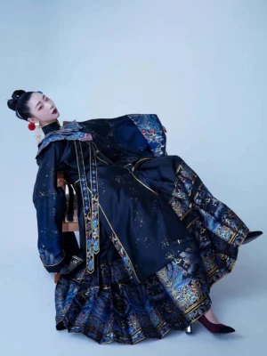 Female model wearing the complete Ming Dynasty Hanfu set with black robe, blue gold diancui-style details, and mamian skirt