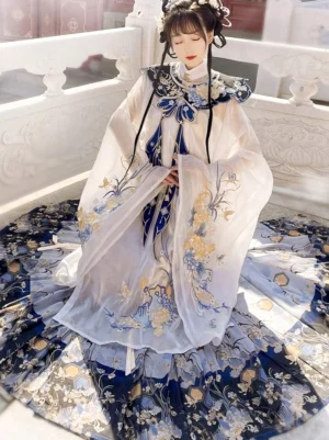 Off-white Ming Dynasty Hanfu set with blue gold floral embroidery, cloud collar, robe and dark blue mamian skirt in a traditional Chinese courtyard