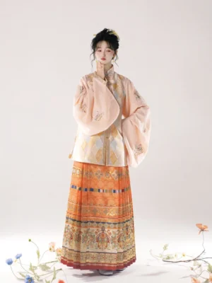 Full length pastel orange Ming Dynasty hanfu outfit with embroidered pipa sleeves stand collar top and patterned mamian skirt