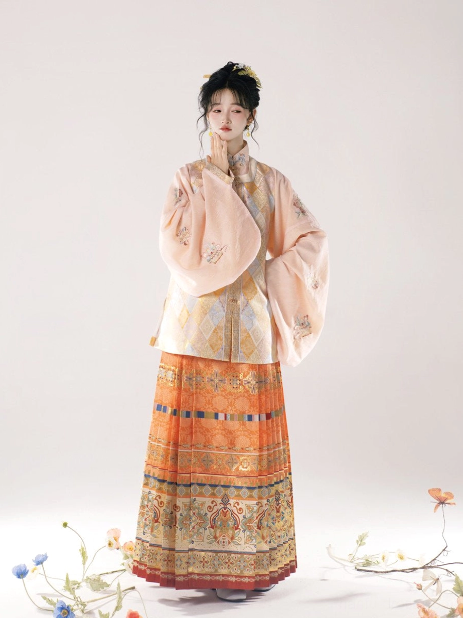 Full length pastel orange Ming Dynasty hanfu outfit with embroidered pipa sleeves stand collar top and patterned mamian skirt