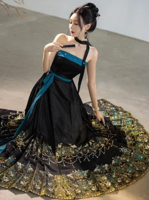 Black and teal Ming Dynasty Hanfu bustier and phoenix feather mamianqun skirt set shown on a seated model with an elegant sweeping embroidered train