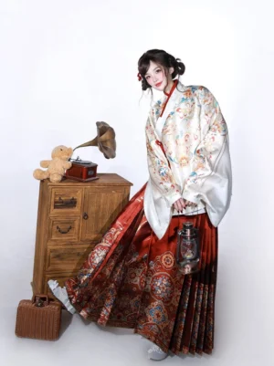 Traditional Chinese Ming Dynasty Hanfu outfit viewed from the side with flowing pipa sleeves red trim and woven horse face skirt