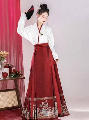 Side view of red Ming Dynasty Hanfu set with embroidered white cross-collar top and floral mamianqun horse face skirt