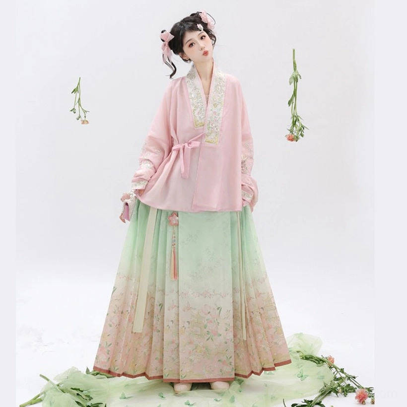 Side view of traditional Chinese Ming Dynasty Hanfu clothing showing tied waist sash embroidered hem and pleated gradient mamian skirt