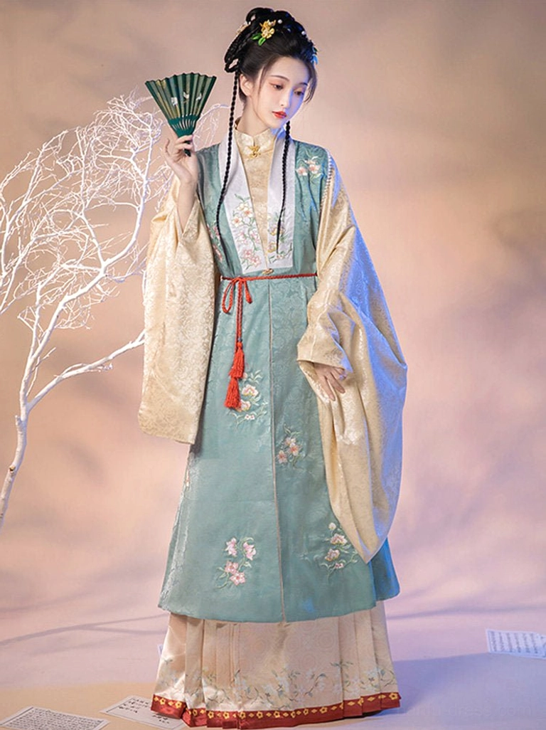 Ming Dynasty hanfu full set with teal embroidered bijia vest beige inner robe and pink mamian skirt styled with a traditional Chinese fan