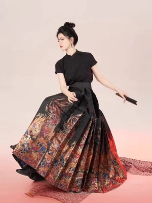 Black Chinese hanfu blouse and ruby printed mamian skirt outfit shown in a seated three-quarter studio portrait