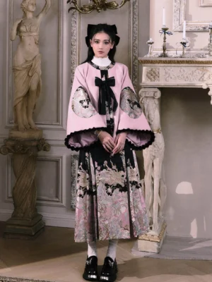 Ming Dynasty inspired pink Hanfu jacket with black pleated mamianqun horse face skirt shown in a full front view