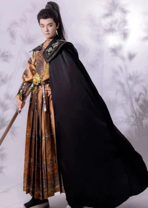 Ming Dynasty Jinyiwei embroidered warrior hanfu costume with black floor length cloak, golden brown robe, traditional embroidery, sword, and male model in ancient Chinese style