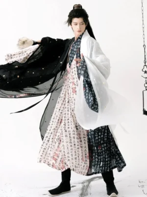 Ming Dynasty inspired men's calligraphy hanfu robe in black and ivory with flowing sleeves and gold fleck accents, shown in a three-quarter full-body view