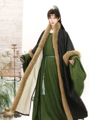 Ming Dynasty men's round collar Hanfu robe with black fur-trimmed coat, dark green inner robe, wide sleeves, tassel waist pendant, and traditional Chinese studio styling