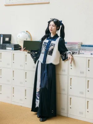 Full-body side view of a woman wearing a Ming Dynasty inspired modern Hanfu outfit with dark navy wide-leg pants, contrasting bijia vest, long-sleeve blouse, and moon palace osmanthus laurel motifs