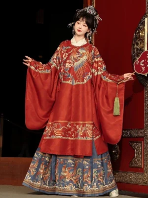 Red Ming Dynasty wedding Hanfu set with golden phoenix embroidered robe and blue mamian skirt front view