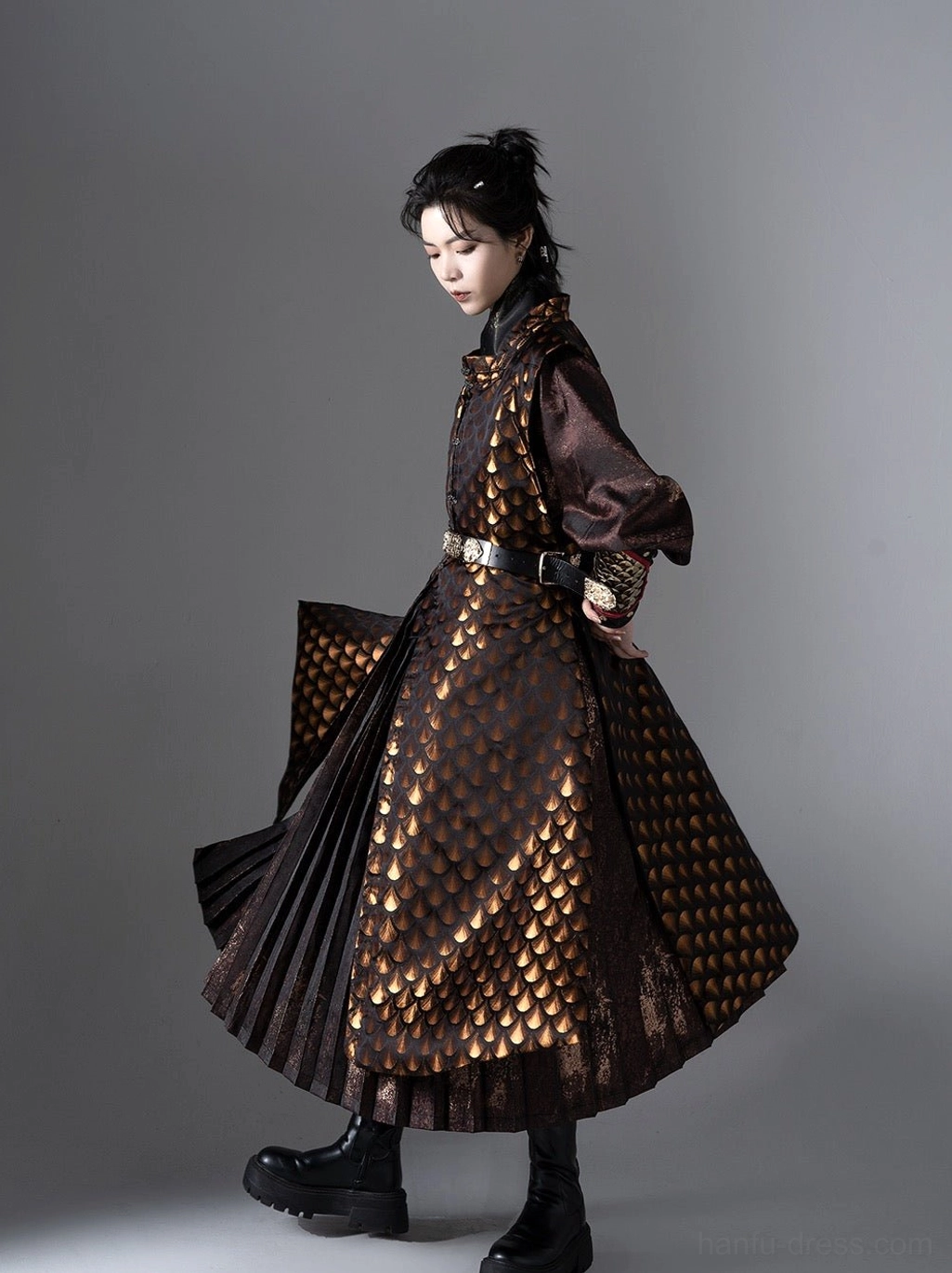 Side profile of a flowing Ming Dynasty inspired Tieli warrior Hanfu robe with dark brown sleeves layered pleats and black boots