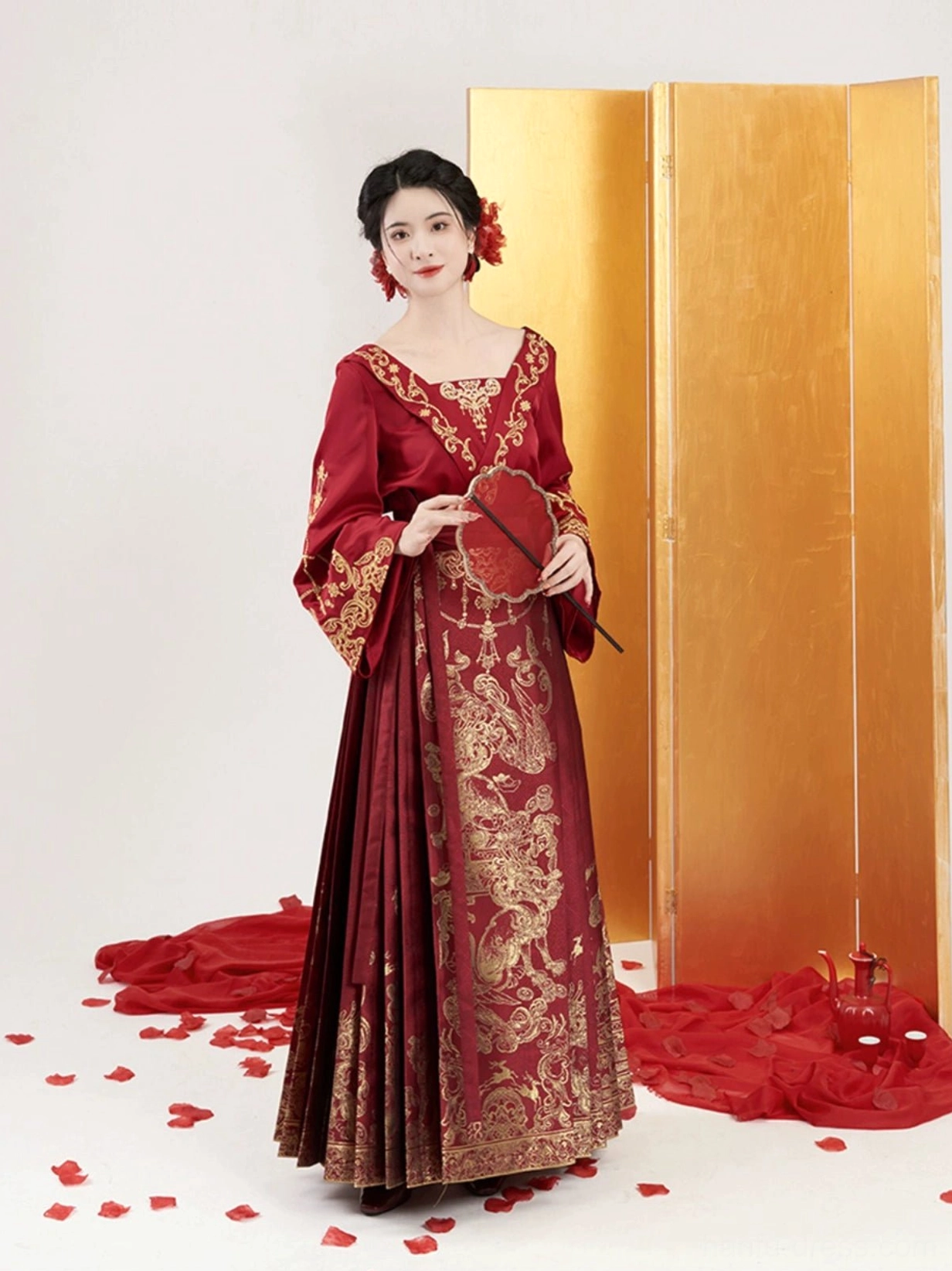 Full front view of crimson and gold Ming Dynasty wedding Hanfu with shoulder-baring top and Mamian skirt