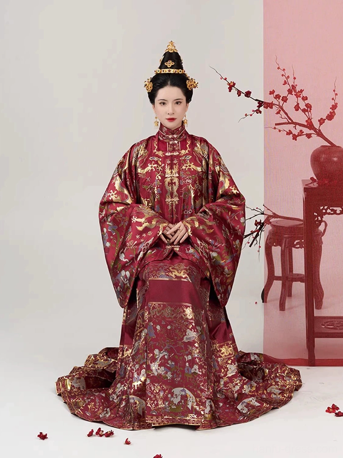 Full Ming Dynasty wedding Hanfu bridal set with layered red brocade tops and long patterned Mamian skirt in a formal seated portrait