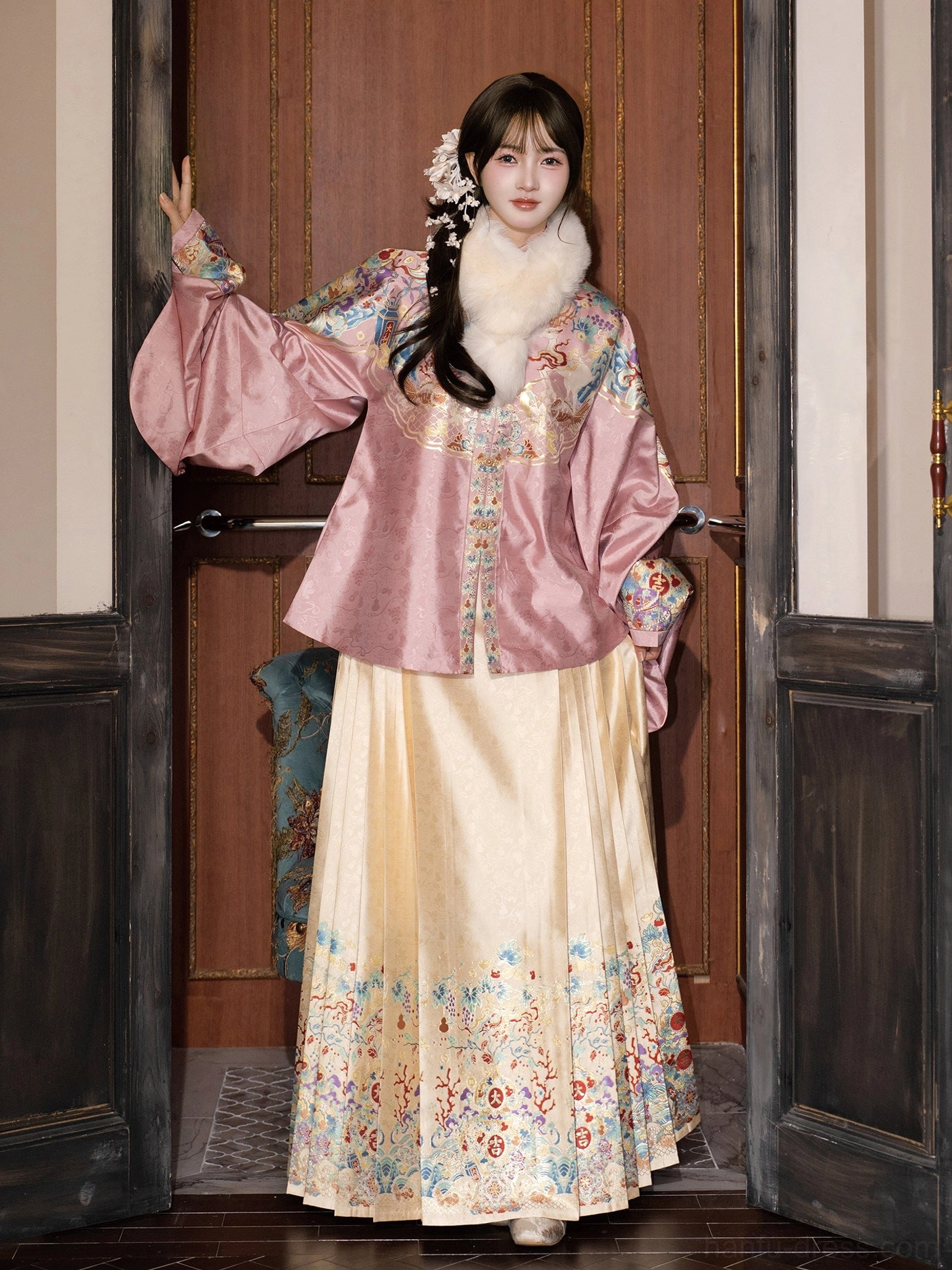 Pink pipa sleeve top and cream mamian skirt in a graceful side view of Ming Dynasty inspired wedding Hanfu