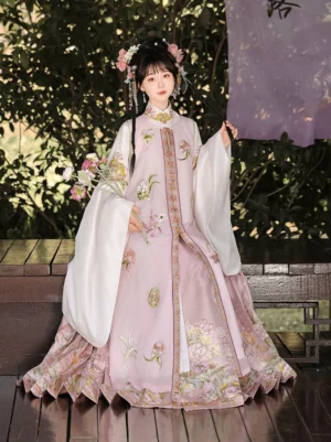 Ming Dynasty women Hanfu outfit with pastel pink embroidered coat pleated floral mamian skirt and traditional flower hair ornaments