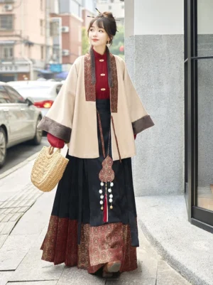 Beige Ming-inspired cross-collar Hanfu jacket with plush cuffs and black red mamianqun horse face skirt outdoor full body view