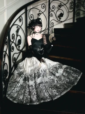 Front three-quarter view of black and ivory printed Ming-inspired Mamianqun horse face skirt styled with a black camisole and vintage folding fan