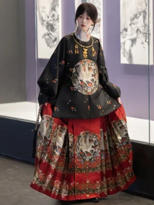 Ming-inspired Chinese New Year Hanfu outfit with black crane round-collar top and red embroidered mamian skirt front view