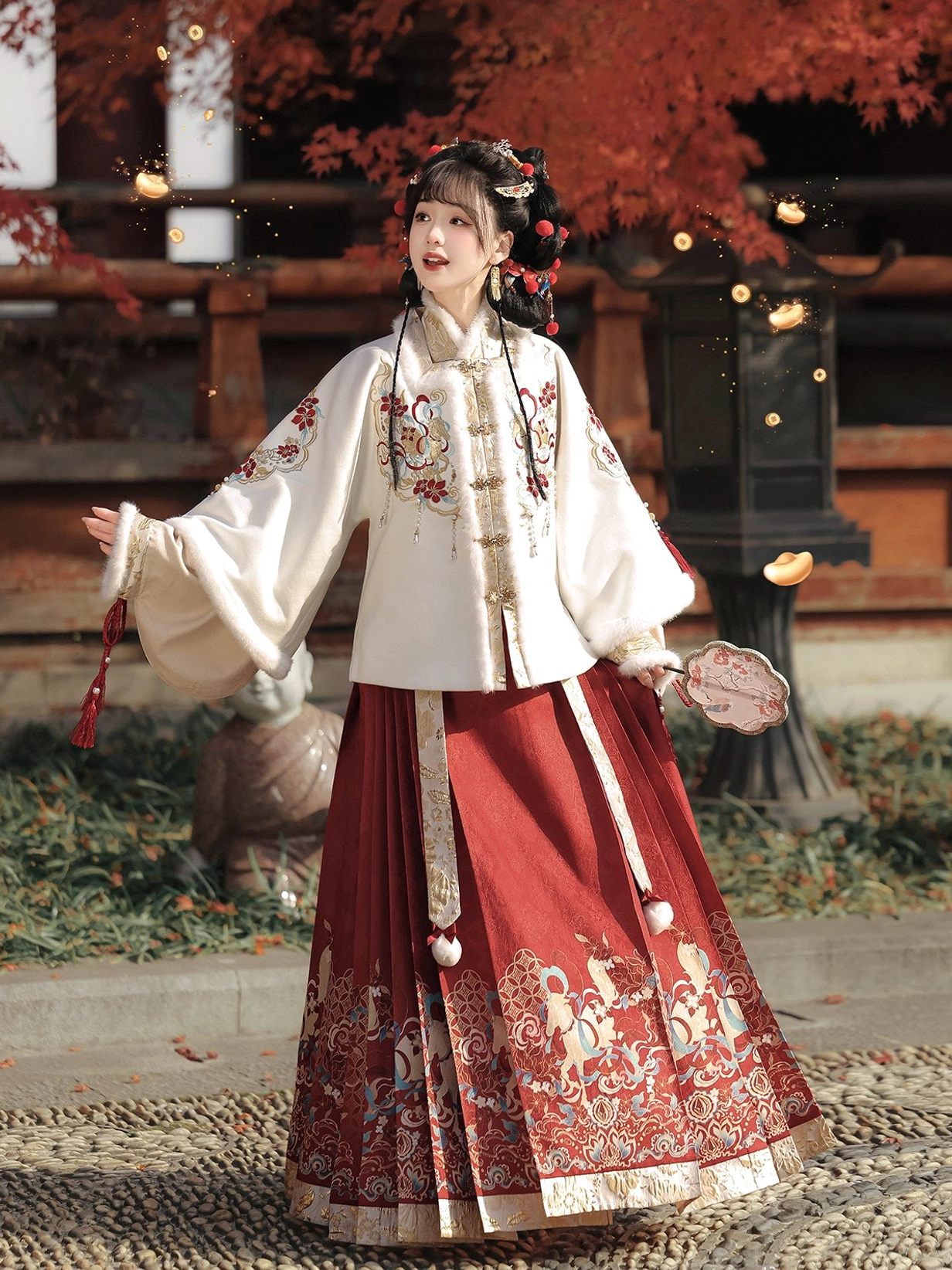 Side view of red Chinese New Year Hanfu mamian skirt set with ivory embroidered top red tassels and pom-pom decorations