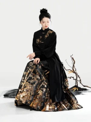 Black Ming-inspired Hanfu blouse and golden bamboo mamian skirt outfit with flowing pleats and traditional Chinese styling
