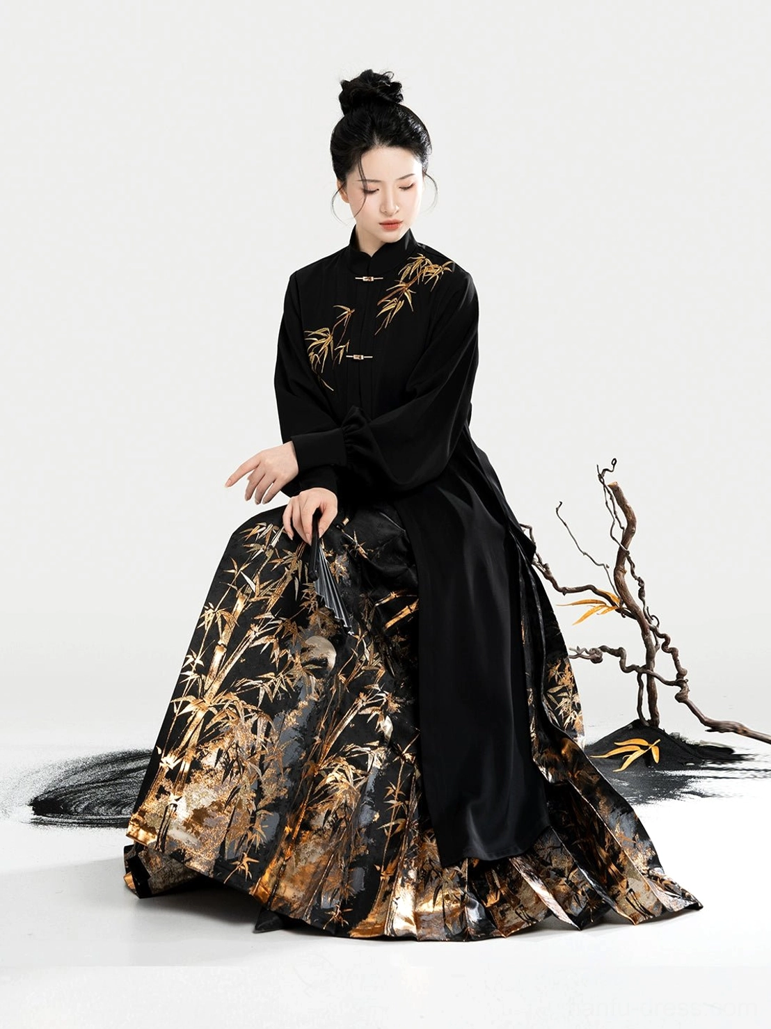 Black Ming-inspired Hanfu blouse and golden bamboo mamian skirt outfit with flowing pleats and traditional Chinese styling