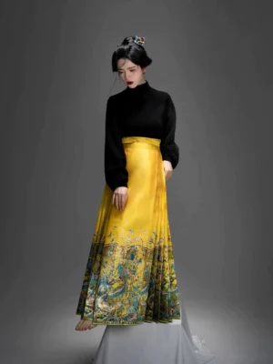 Front three-quarter view of a Ming-inspired Chinese hanfu outfit with black stand-collar blouse and yellow kingfisher printed Mamian skirt