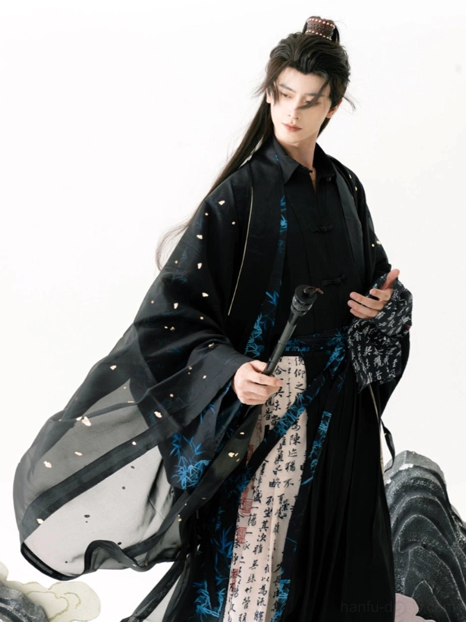 Ming inspired male Hanfu costume with oversized flowing sleeves, blue bamboo pattern trim, printed calligraphy skirt panels, and layered black Taoist robe styling