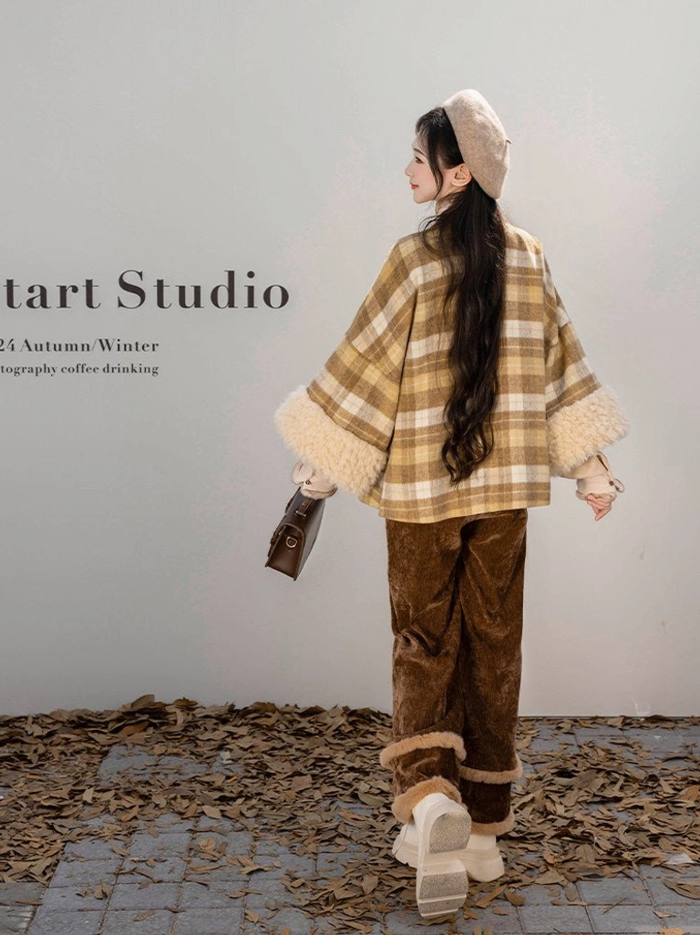 Back view of Ming inspired Hanfu plaid jacket and faux fur trimmed brown wide leg corduroy pants in autumn leaves