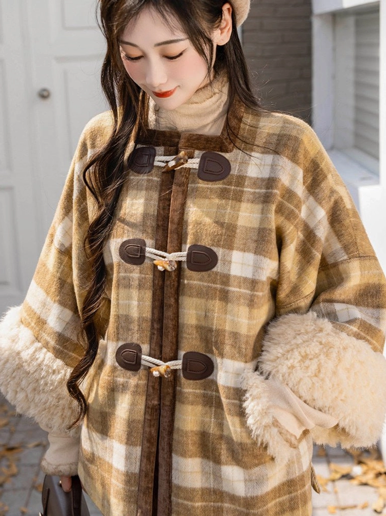 Close-up detail of yellow brown plaid wool blend Ming inspired Hanfu jacket with stand collar horn toggles and faux fur cuffs