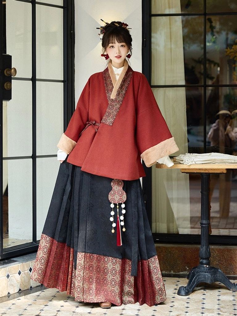 Red Ming-inspired cross-collar Hanfu jacket and black mamianqun horse face skirt full set front view indoors