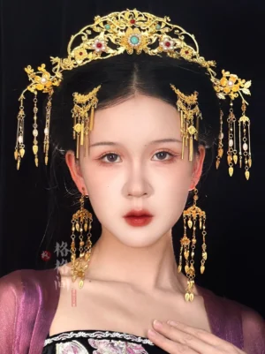 Ming phoenix Hanfu bridal hair accessory set worn with purple traditional Chinese style outfit, featuring gold tone crown, imitation pearls, colored gems and long tassels