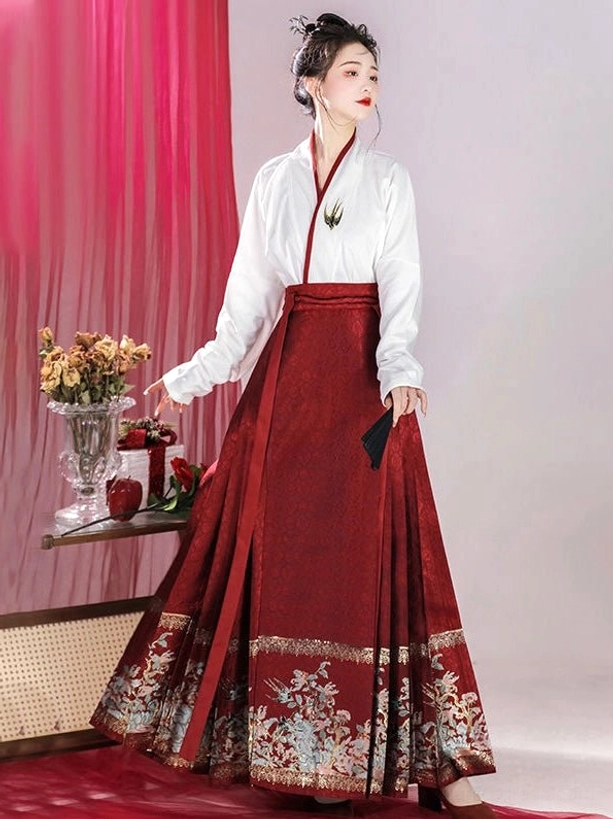 Full side view of red embroidered mamianqun horse face skirt and white Ming-style cross-collar Hanfu top