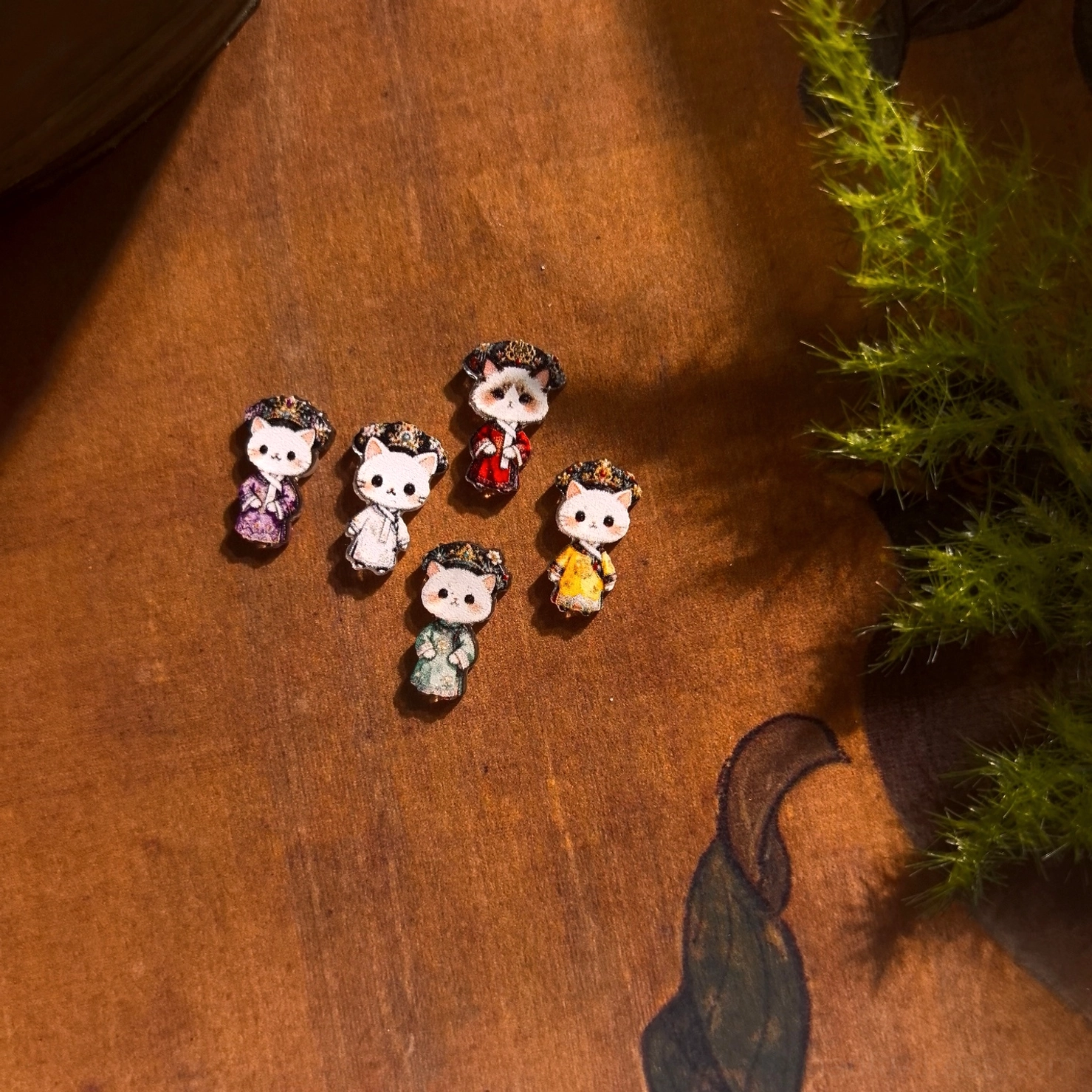 Miniature cat empress Hanfu jewelry charms styled in colorful Chinese imperial court dress designs
