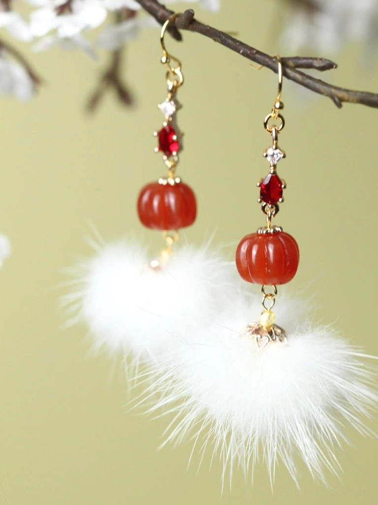Mink furball pumpkin bead Chinese earrings hanging from a branch with red zircon drops and fluffy white pompom details