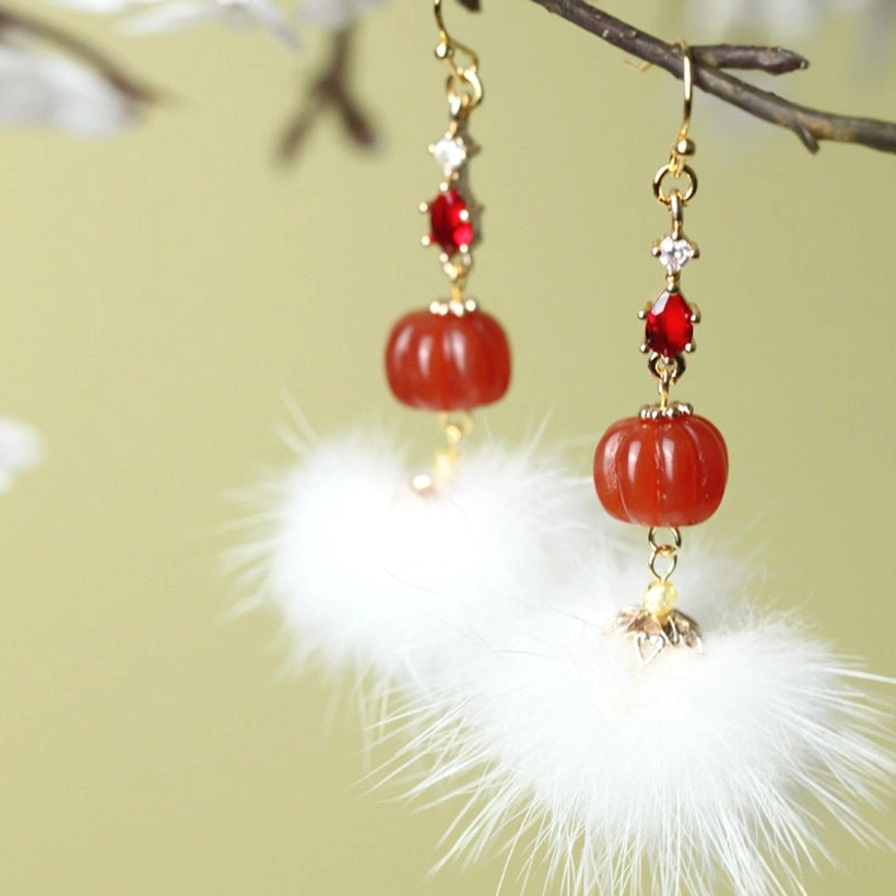Hook style mink furball pumpkin bead Chinese drop earrings with red zircon teardrops hanging on a tree branch