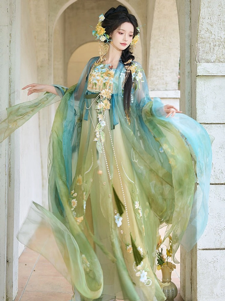 Fairy style Tang Dynasty Heziqun Hanfu side view with yellow green gradient dress, floral embroidery, and dramatic blue sheer wide sleeves