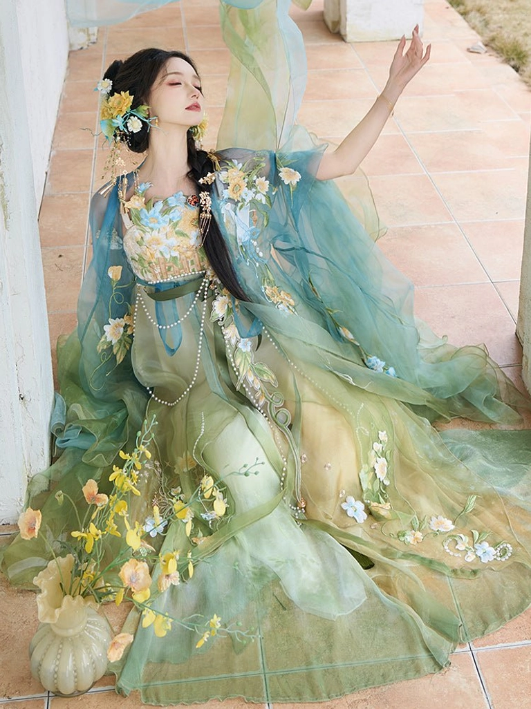 Mint Garden floral Tang Dynasty Hanfu viewed from above, showing the flowing green gradient skirt, embroidered flowers, long outer robe, and pearl waist pendant