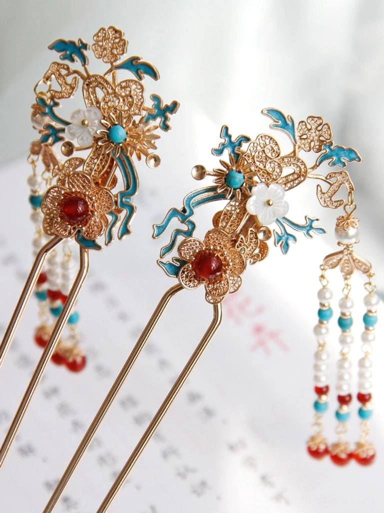 Mismatched pair of vintage Chinese hairpins with blue cloisonne-style floral ornament white shell flower red bead centers and long beaded tassel