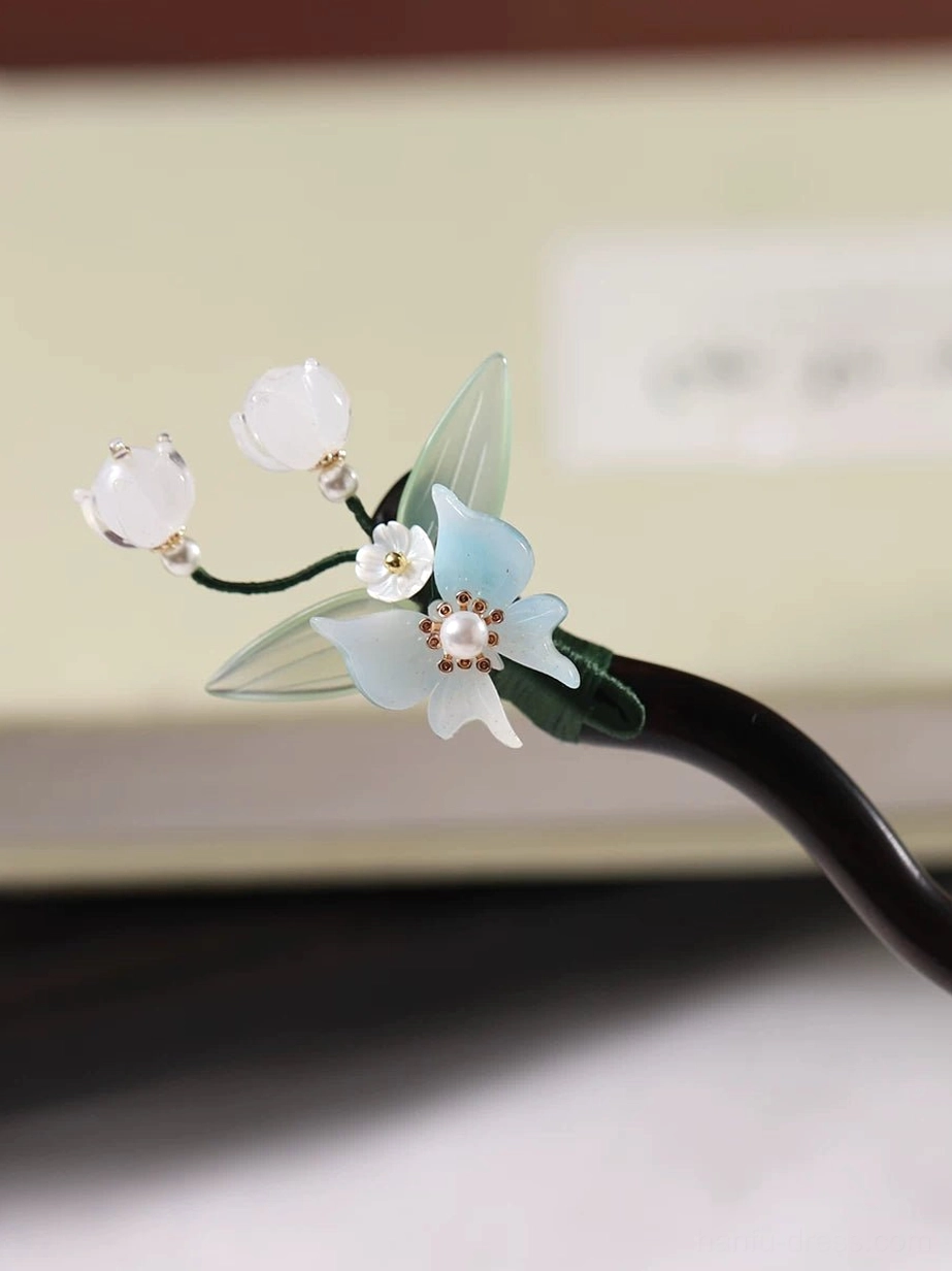 Vintage-inspired Chinese hair stick with blue orchid white bell flowers and dark wooden shaft for elegant buns