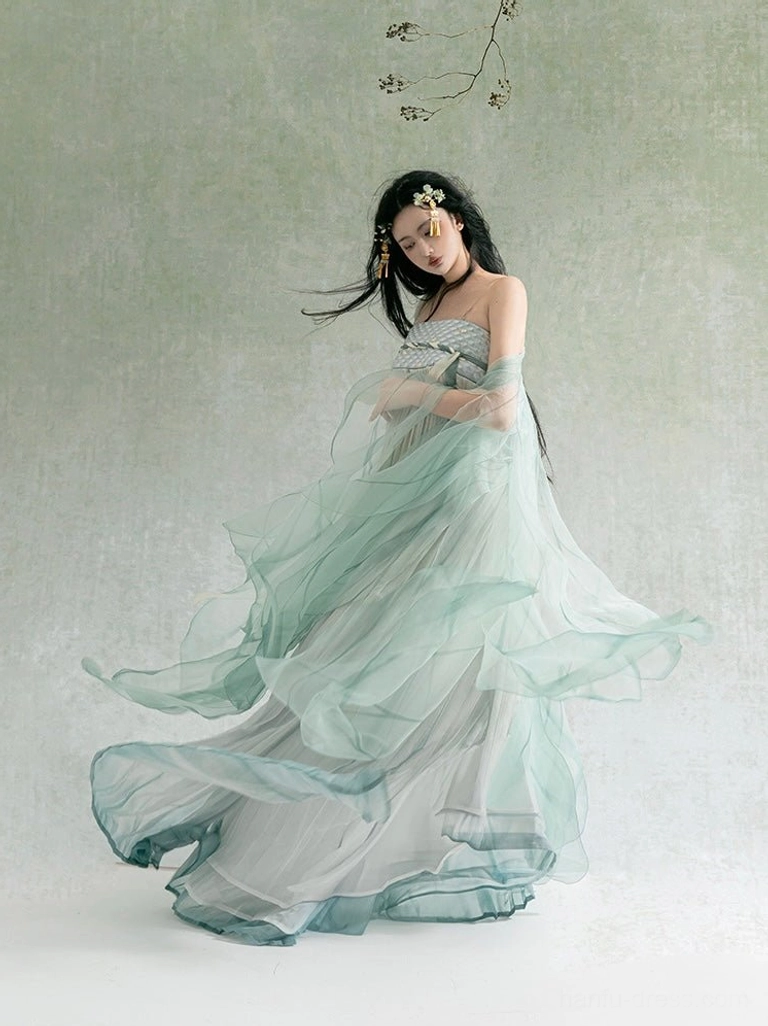Three-quarter view of Mist Green gradient modern Hanfu dress with flowing chiffon skirt, soft draped shawl, and darkened hem