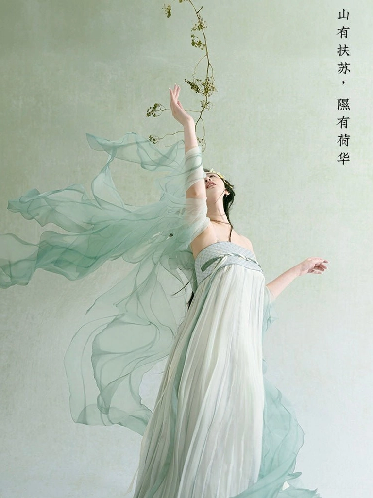 Back and side view of Mist Green Tang-style Hanfu maxi dress with fluttering sheer shawls, pleated chiffon skirt, and dramatic movement