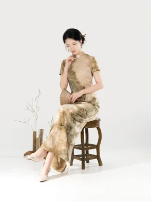 Misty Green Hills Chinese style cheongsam dress side sitting view showing fitted waist and beige green mountain landscape pattern