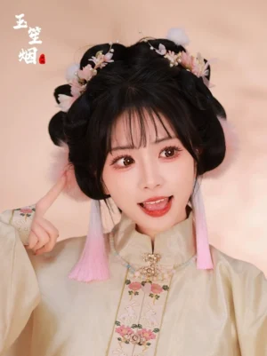 Model wearing misty pink pom-pom tassel Hanfu hair accessory set with floral clips and embroidered Ming-style Hanfu