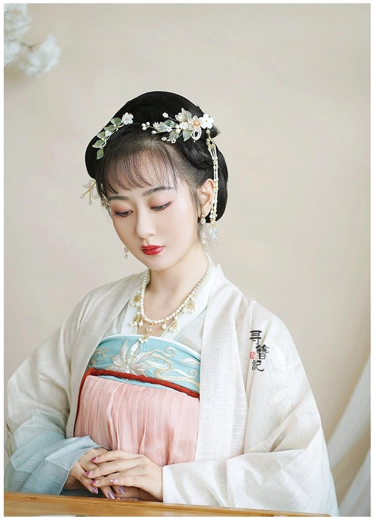 Model wearing traditional Chinese Hanfu with Magical Bloom floral hair ornaments in an elegant classical hairstyle