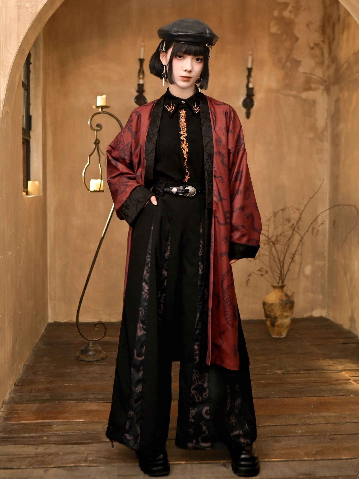 Full coordinated modern Chinese fashion outfit featuring a black and red long Hanfu coat, dark inner shirt, wide-leg pants, silver waist belt, and retro beret