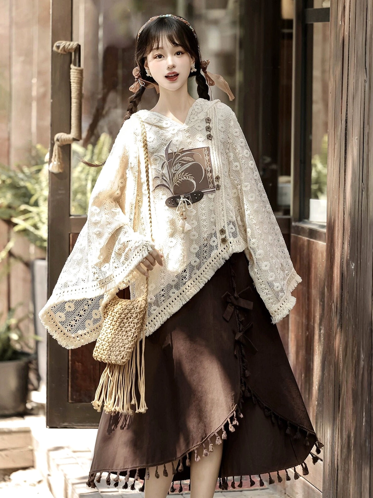 Modern Chinese fashion Hanfu two-piece set styled with a woven straw crossbody bag, beige floral lace top, and brown asymmetric skirt near a wooden doorway