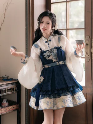 Full front view of modern Chinese-style Hanfu dress outfit with off-white pipa sleeve blouse, navy embroidered skirt, traditional motifs, and tea ware