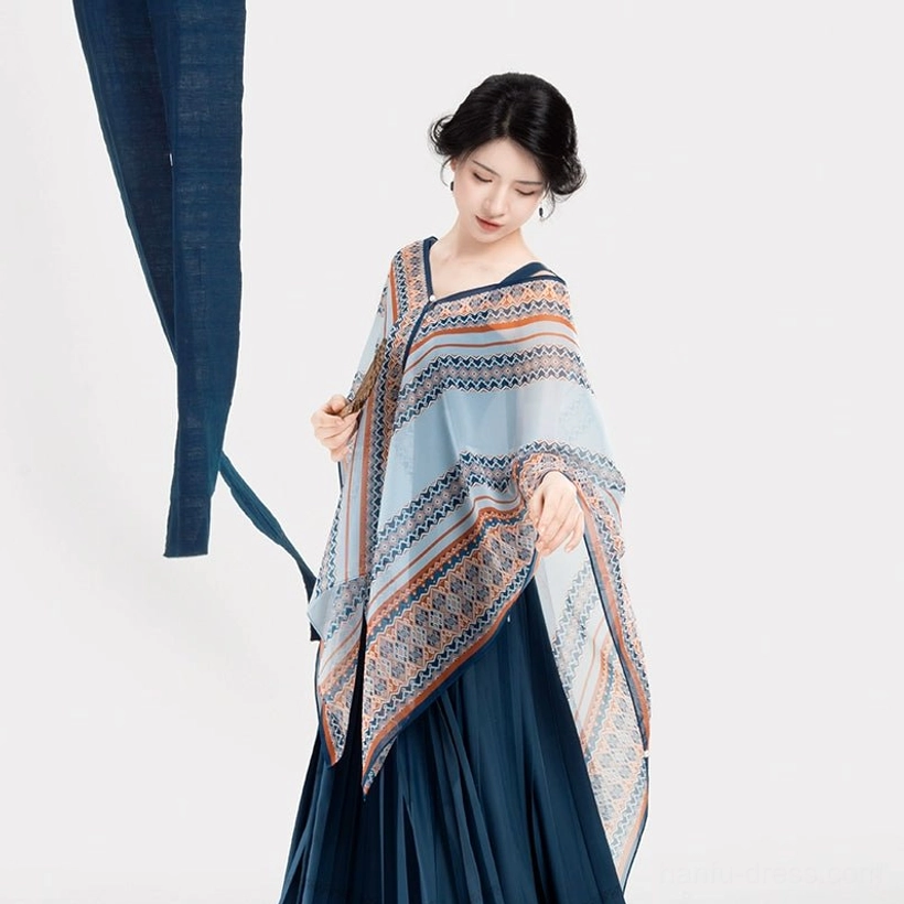 Side full-body view of a modern Chinese Hanfu pleated dress and ethnic-inspired shawl with flowing skirt volume and decorative hem border